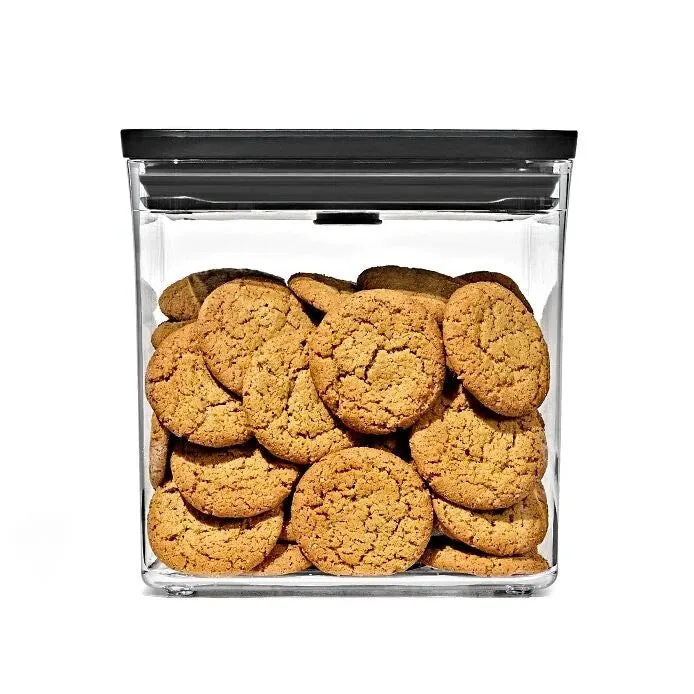 Matte-black-lid POP container filled with cookies for scale.