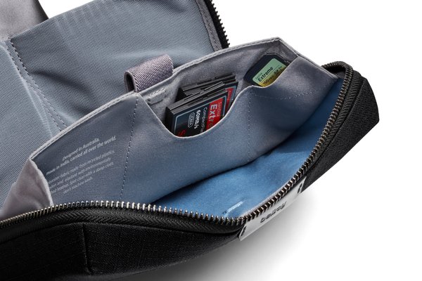 Interior detail of the black Bellroy Tech Kit showing fabric pockets