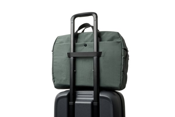 Bellroy Tokyo Work Bag: The luggage pass-through is shown over a suitcase handle.