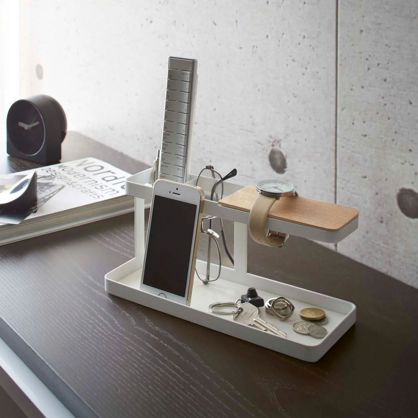 White Tower Deskbar holding a phone, glasses, a watch and pocket items