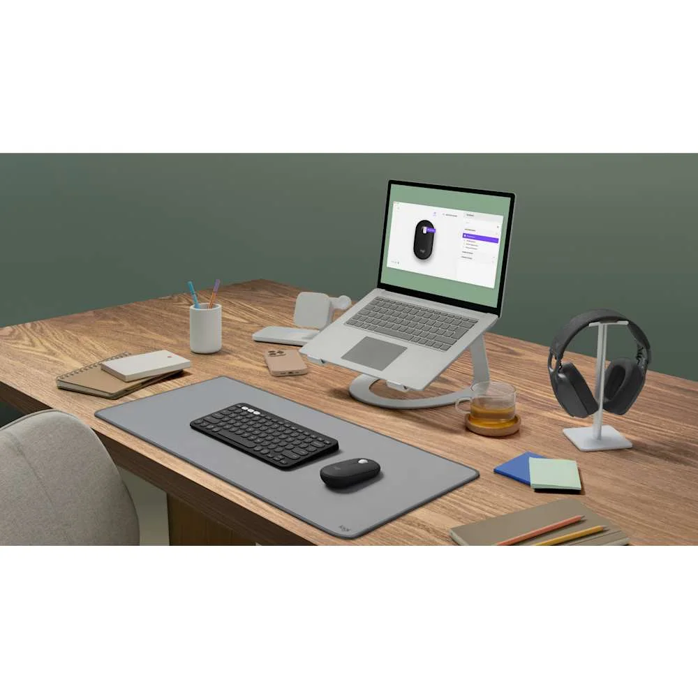 Black Pebble Mouse 2 M350s in a multi-device desk setup