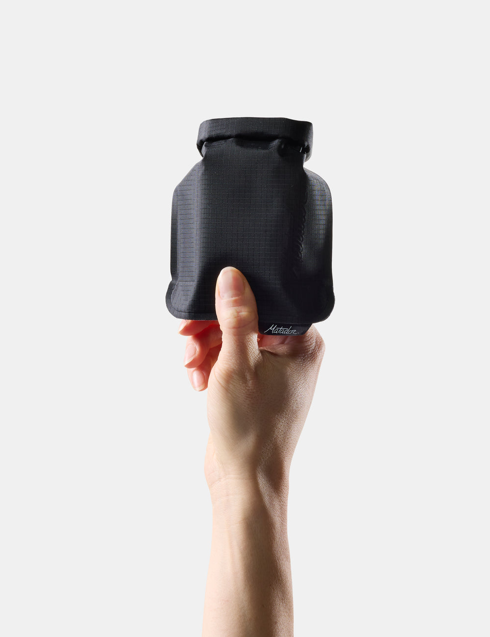 Black Matador FlatPak V2 held in one hand