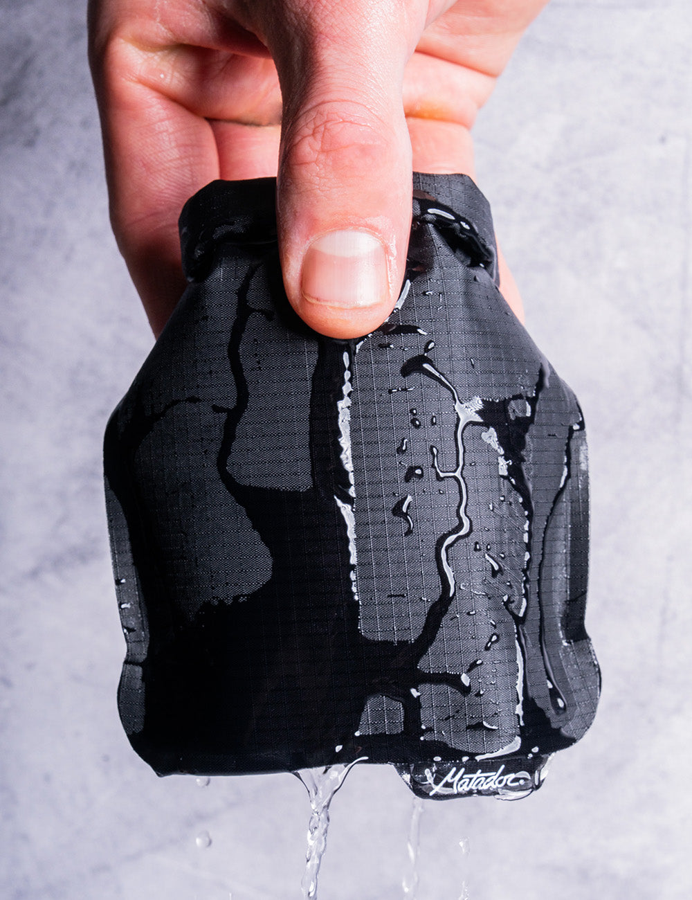 Water running over the black Matador FlatPak V2