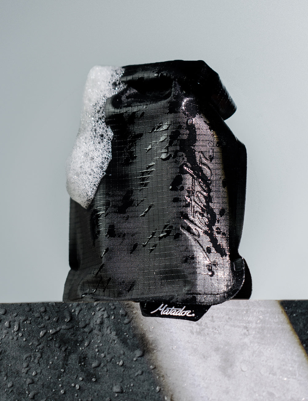 Black Matador FlatPak V2 wet with soap suds