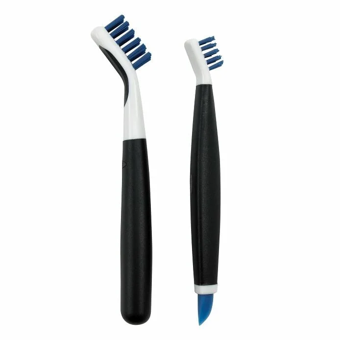 Large and small OXO Deep Clean brushes with blue bristles and a blue wiper tip