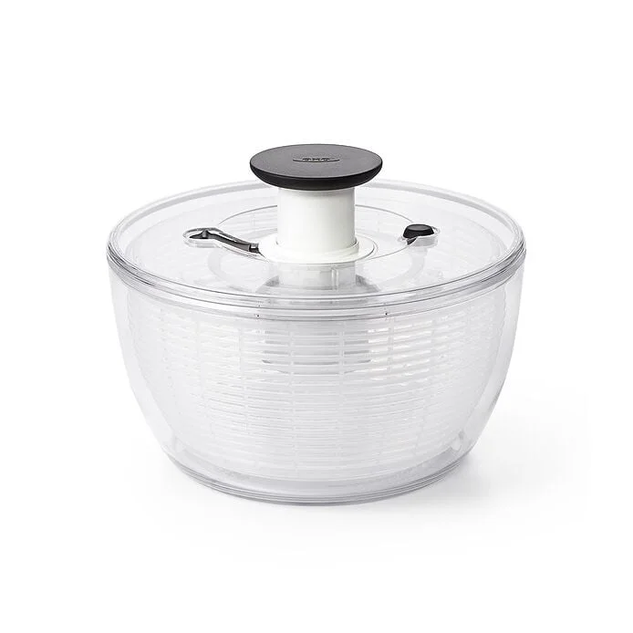 White OXO Good Grips salad spinner shown assembled with the pump lid