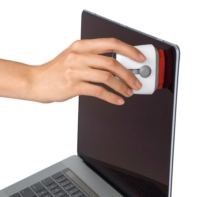 Manufacturer demonstration of the OXO Sweep & Swipe microfiber pad against a laptop screen