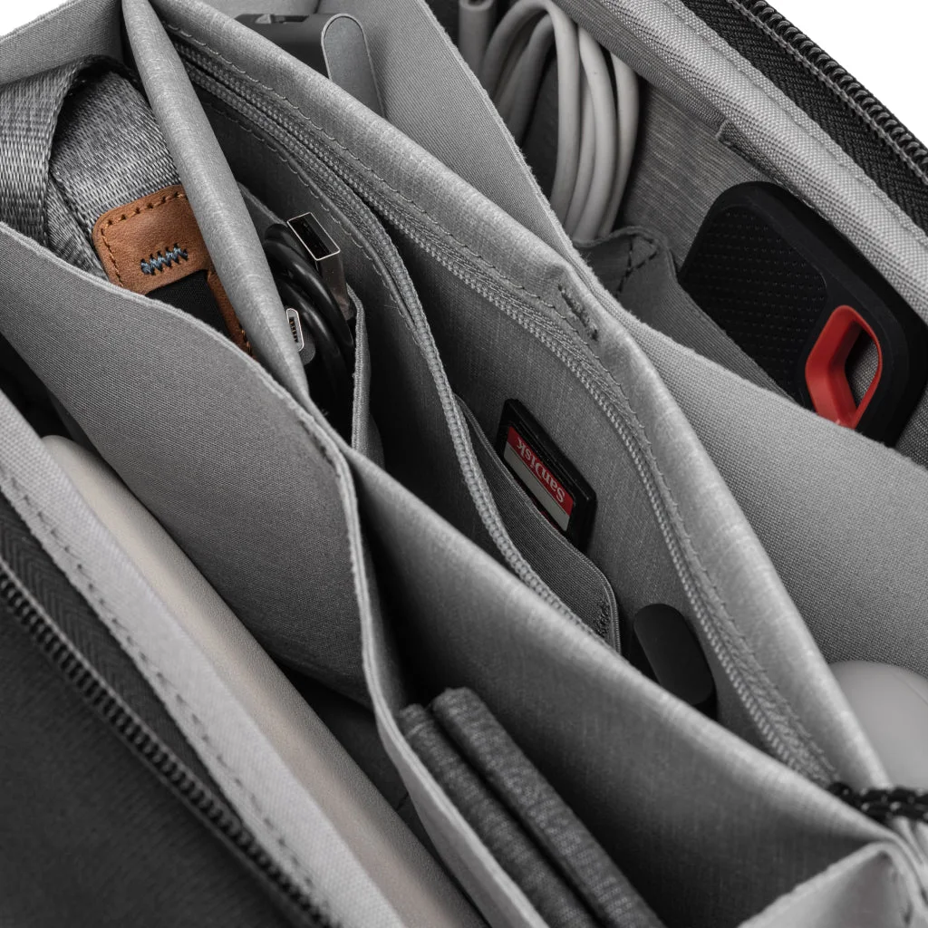 Black Tech Pouch shown with organized electronics