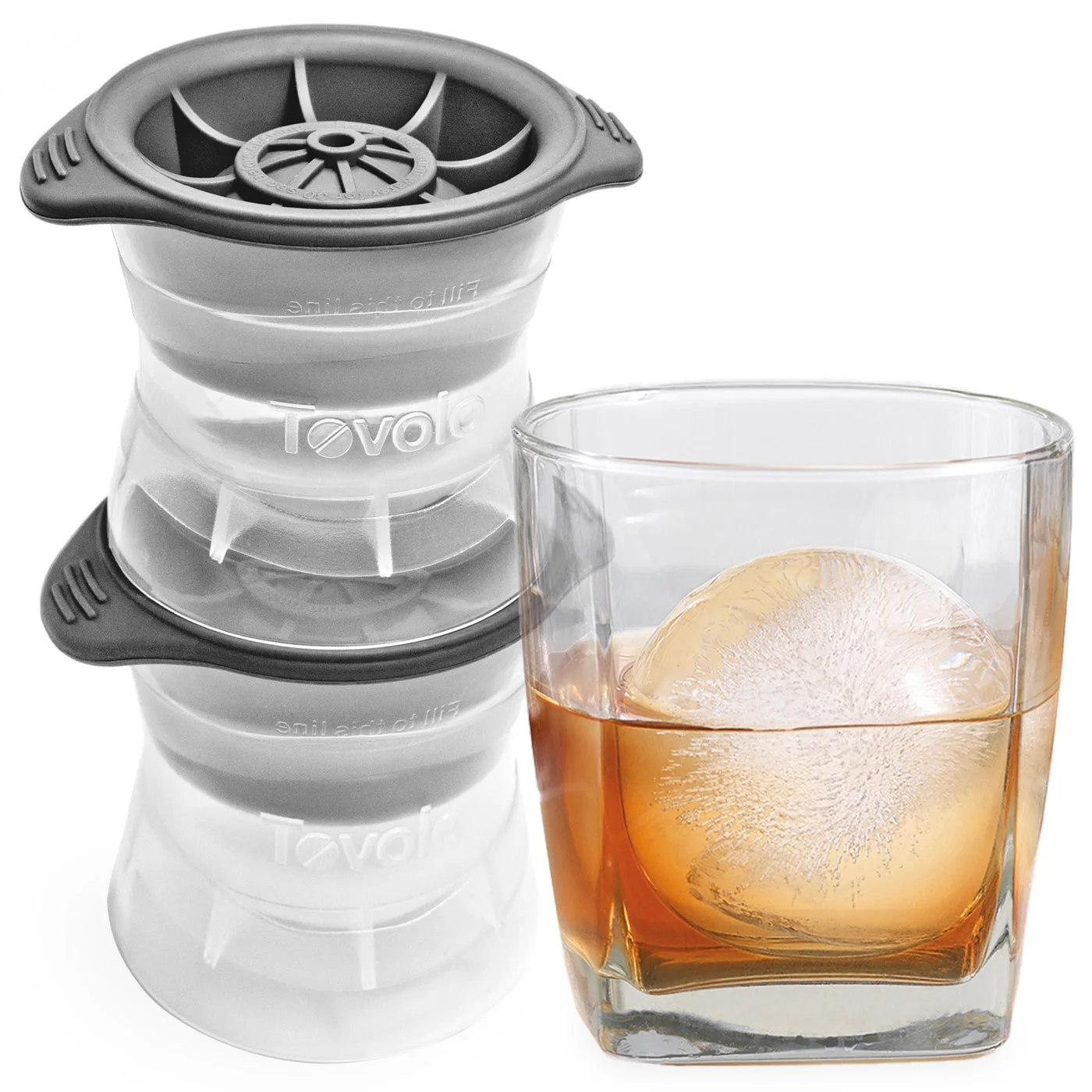 Two classicTovolo sphere molds stacked beside a finished drink; glass notincluded.