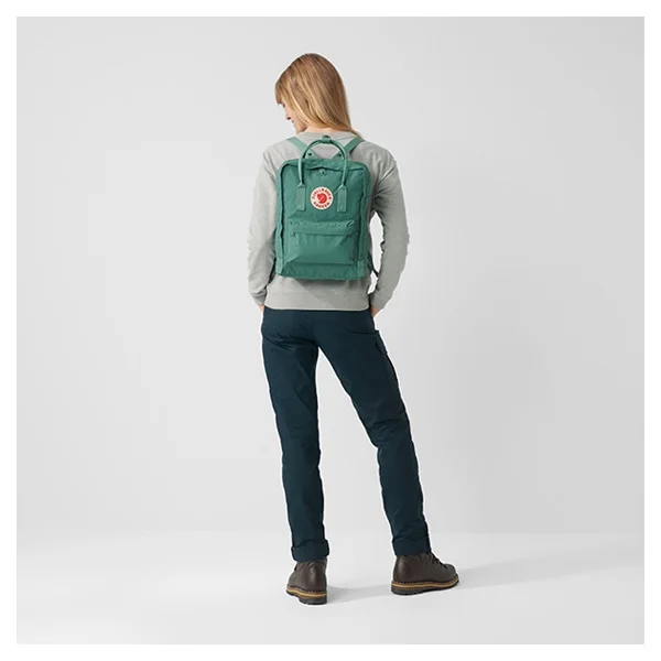 Green Original Kanken worn on the back illustrates the simple strap arrangement; Black is the linked variant.