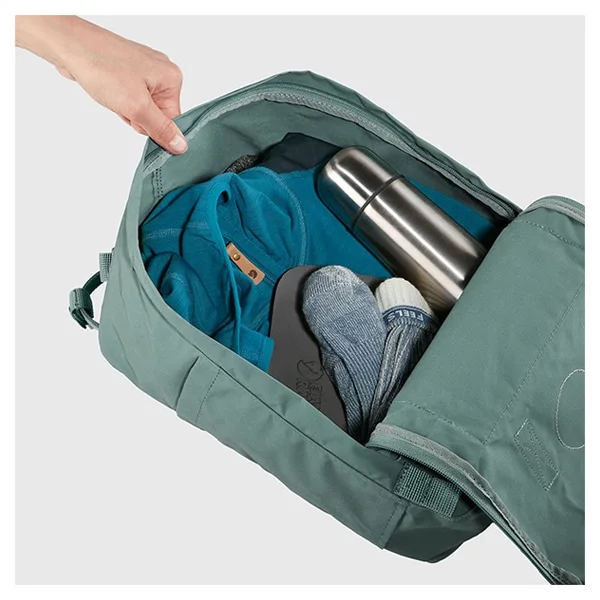 Manufacturer feature photo in a different green colour illustrates the wide opening and packing area; linked colour is Black.