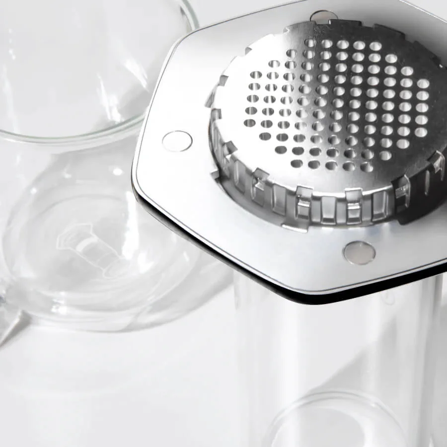 The stainless steel cap holds the filter and can be hot after brewing.
