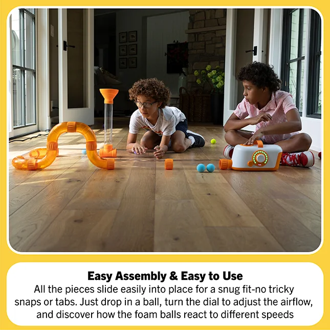Children adjust a low tube layout in a manufacturer scene; allow a clear play area around the toy.