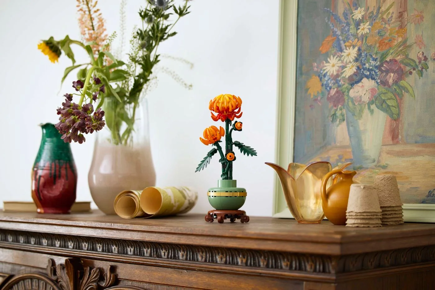 Chrysanthemum displayed on a sideboard; surrounding furnishings are props.