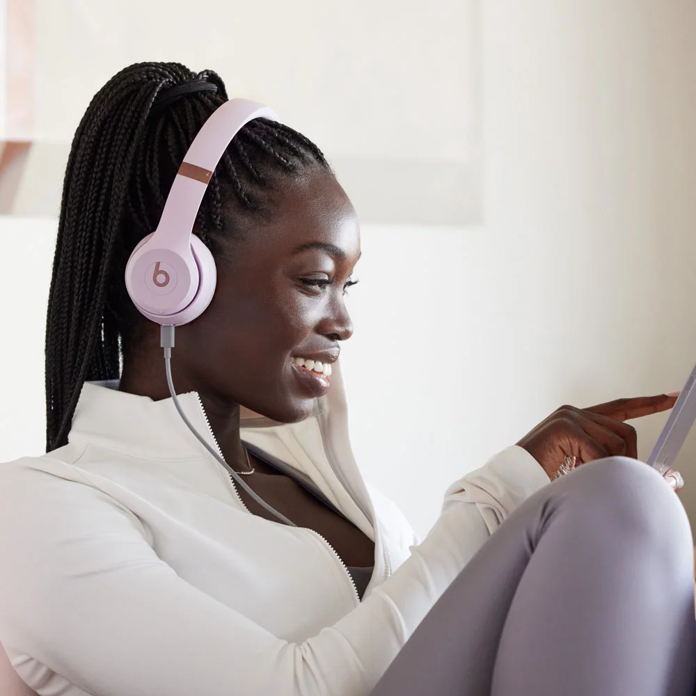 USB-C wired listening scene with Cloud Pink headphones.