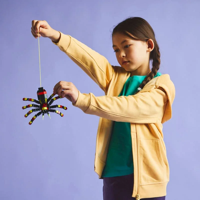 Manufacturer play scene showing the hanging feature and the model's scale.