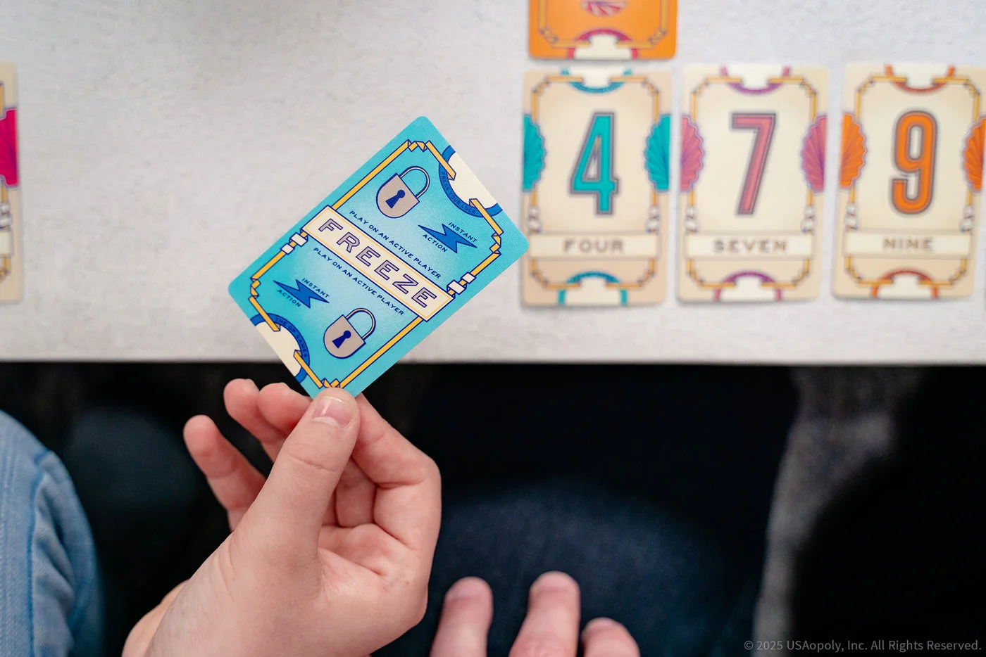 Players considering an action card in a staged scene.