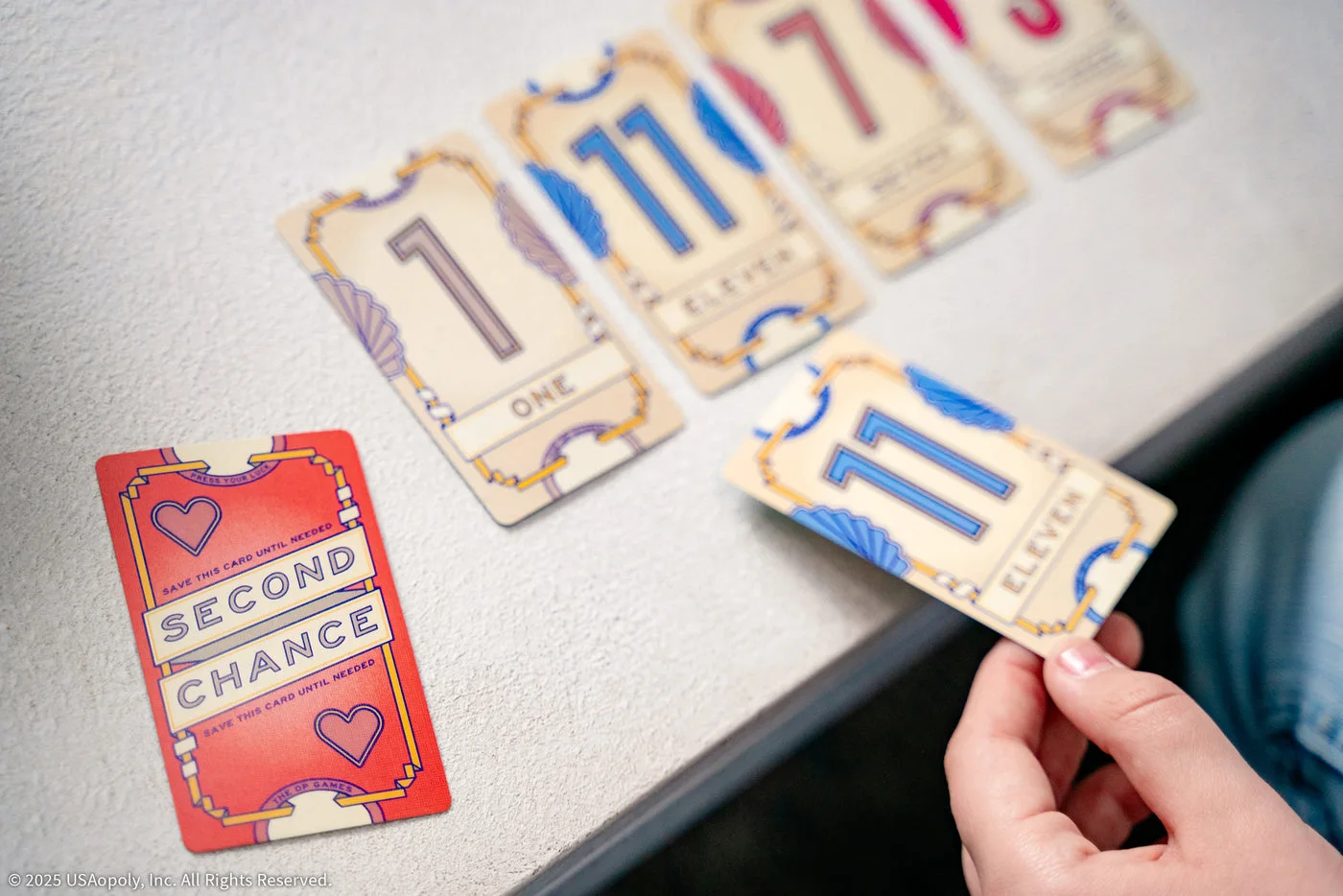 A hand of number cards and Second Chance card.