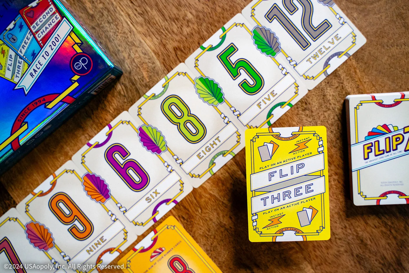 Several cards displayed beside the box.