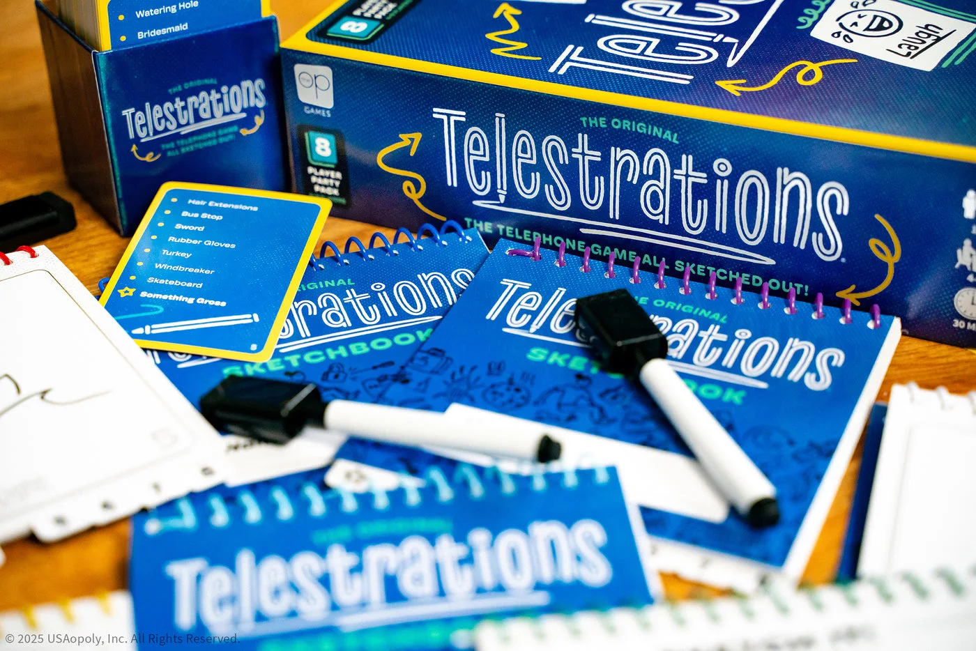Box, books and cards in a detailed tabletop photograph.