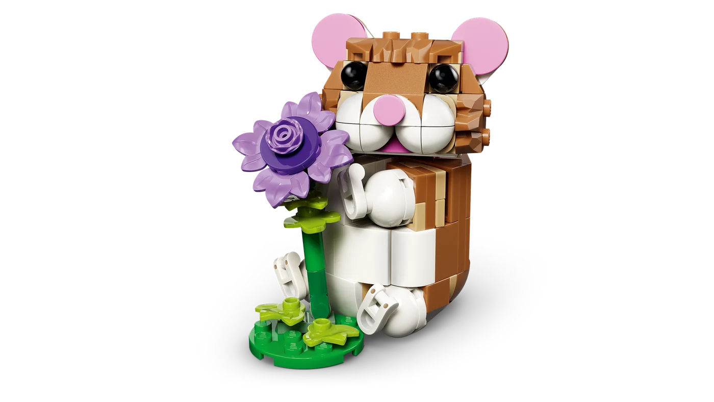 Hamster build holding its purple flower.