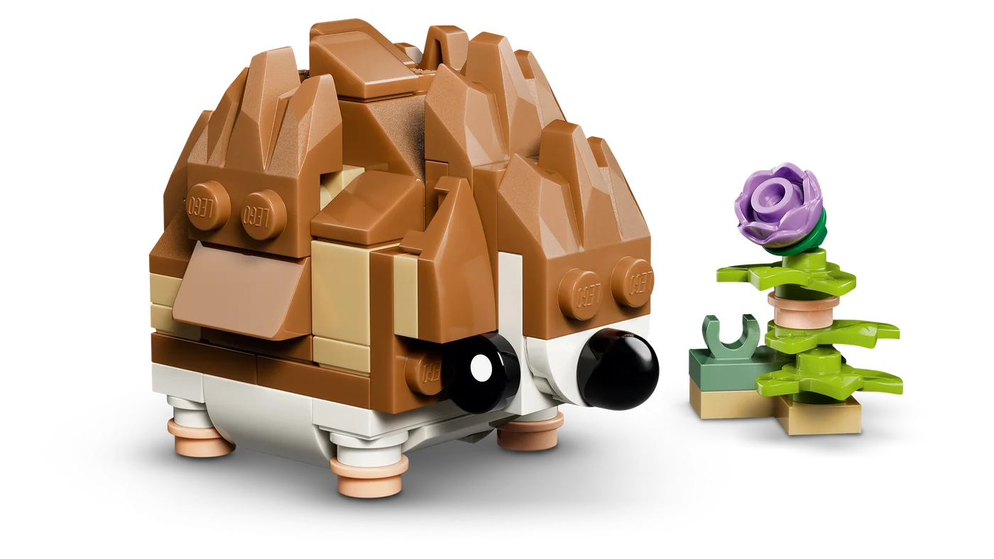 Alternative hedgehog build beside a flower.