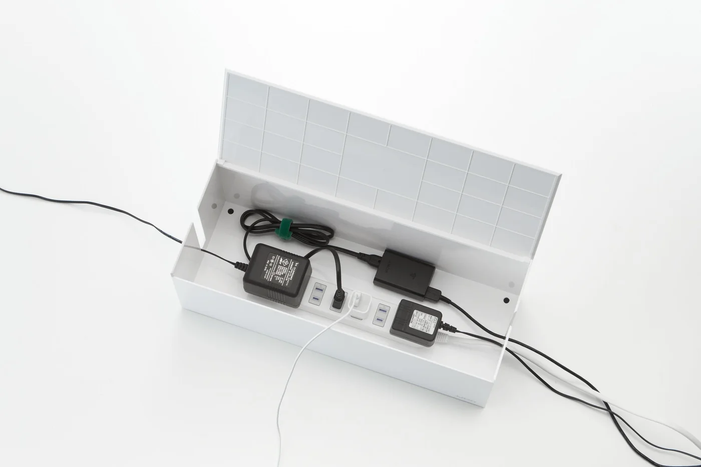 Lid removed to show a sample power-strip arrangement.