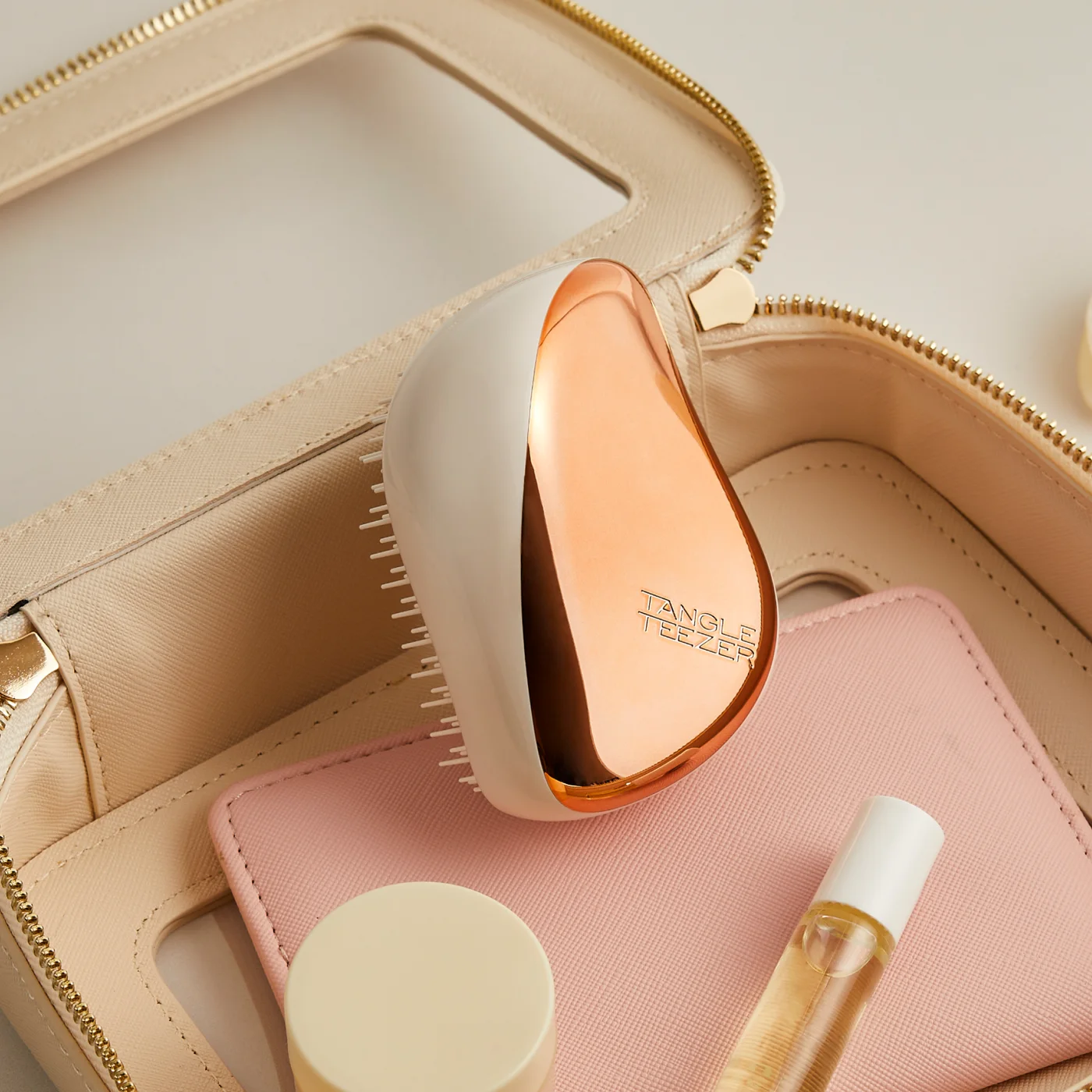 The compact brush in a manufacturer handbag scene.