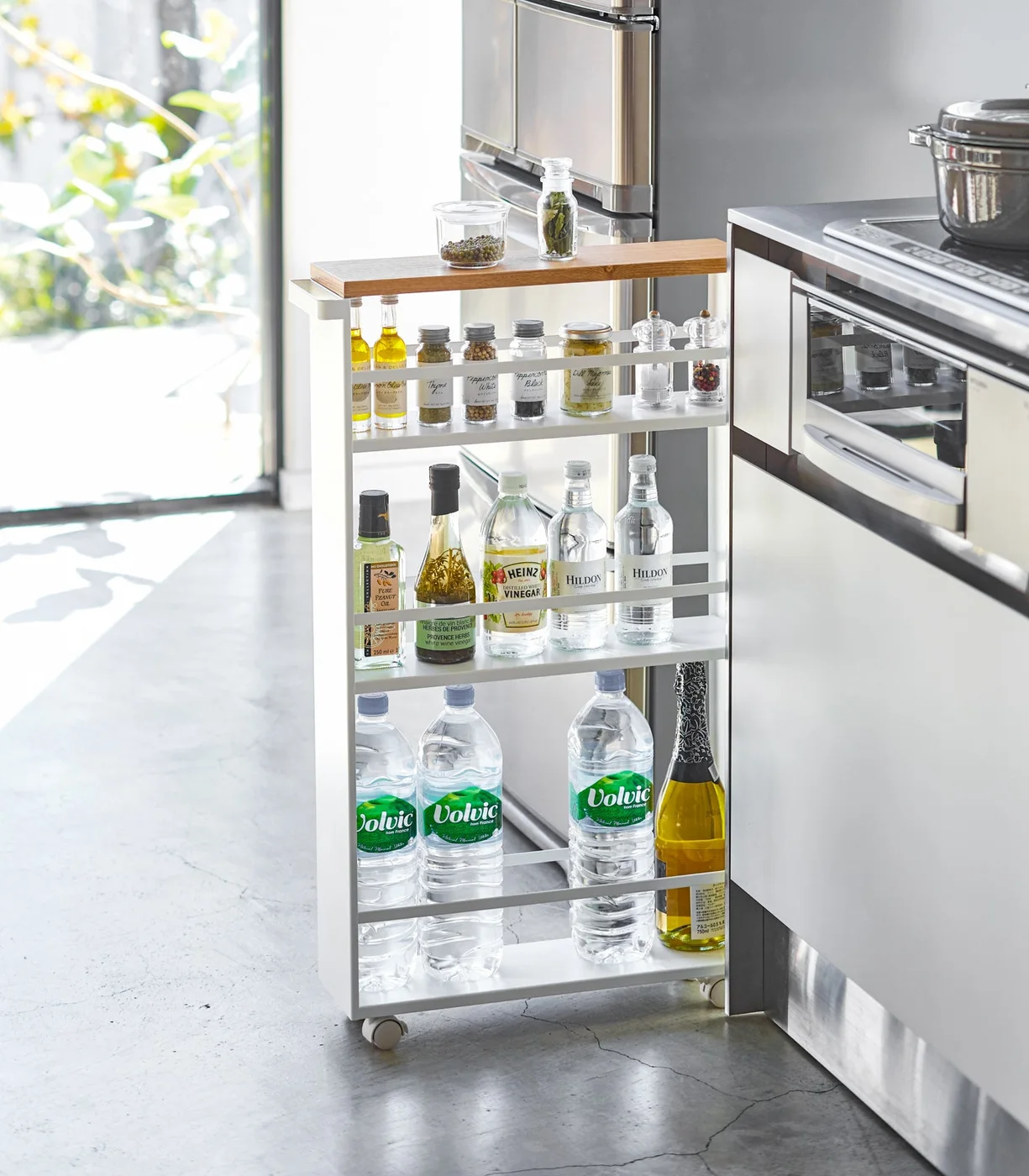 White cart beside a kitchen counter.