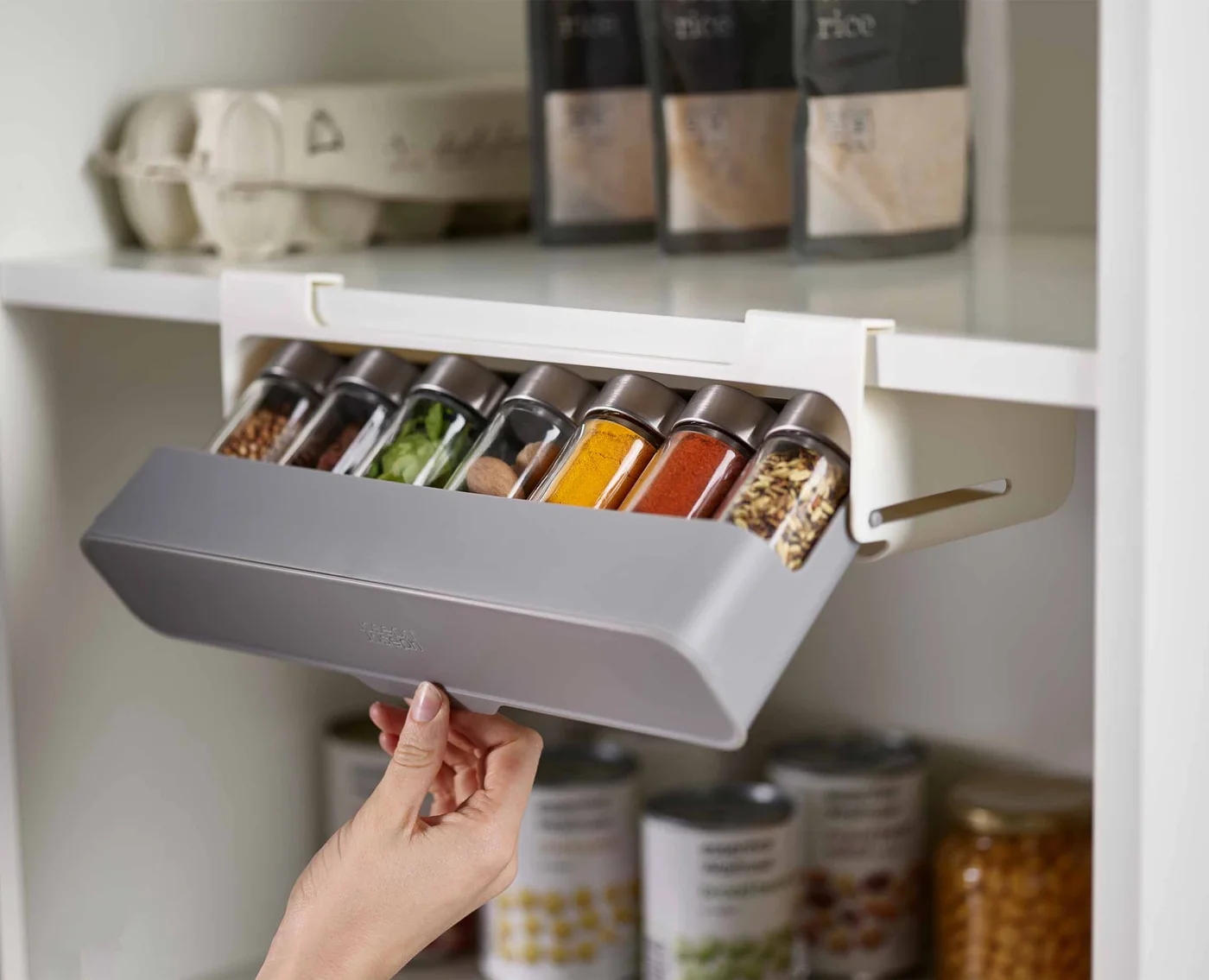 Angled compartment showing example jars; measure your own containers.