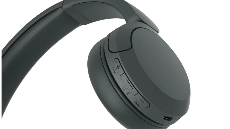 Physical buttons and charging connection on the earcup.