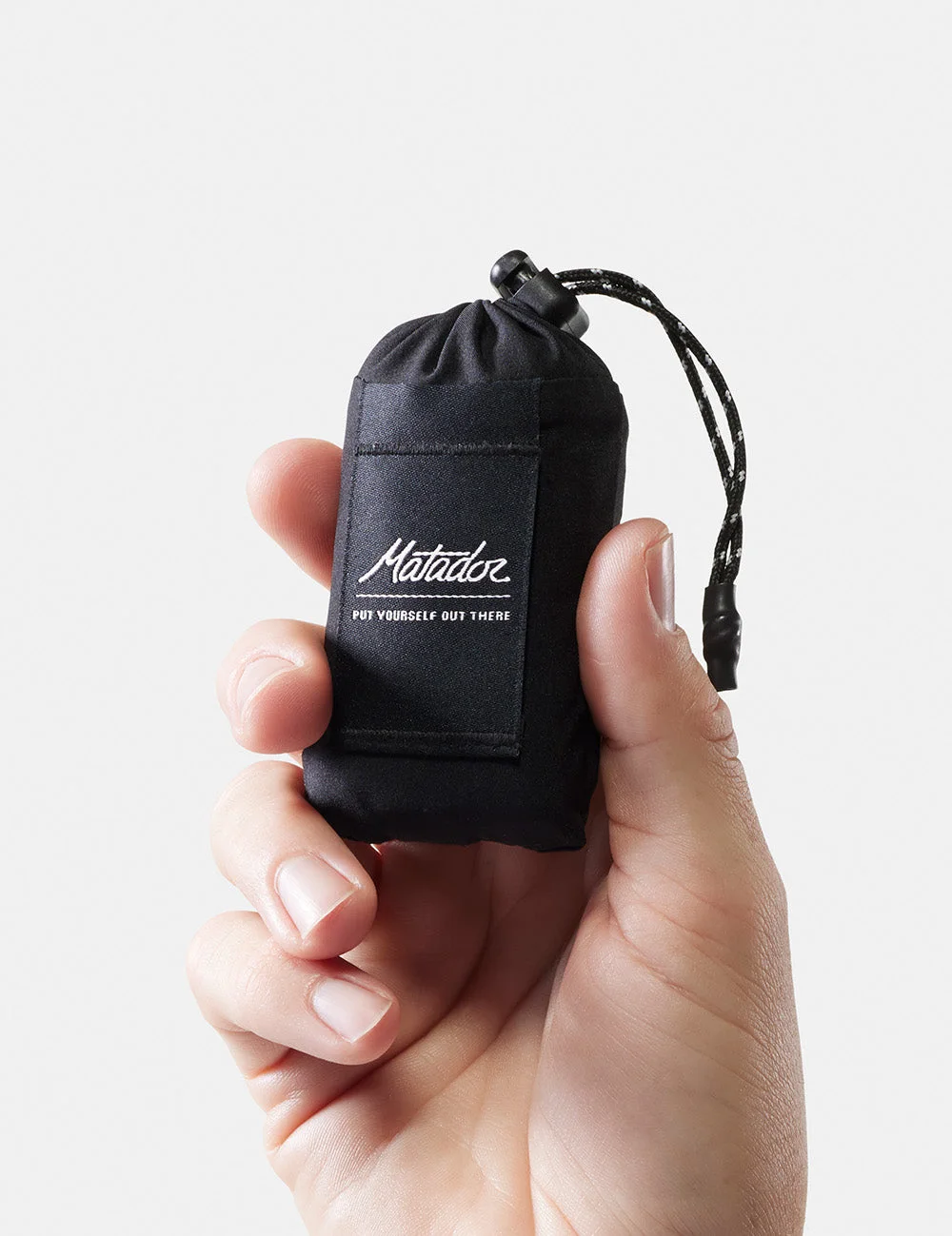 Packed size illustrated in a manufacturer's hand-held photograph.