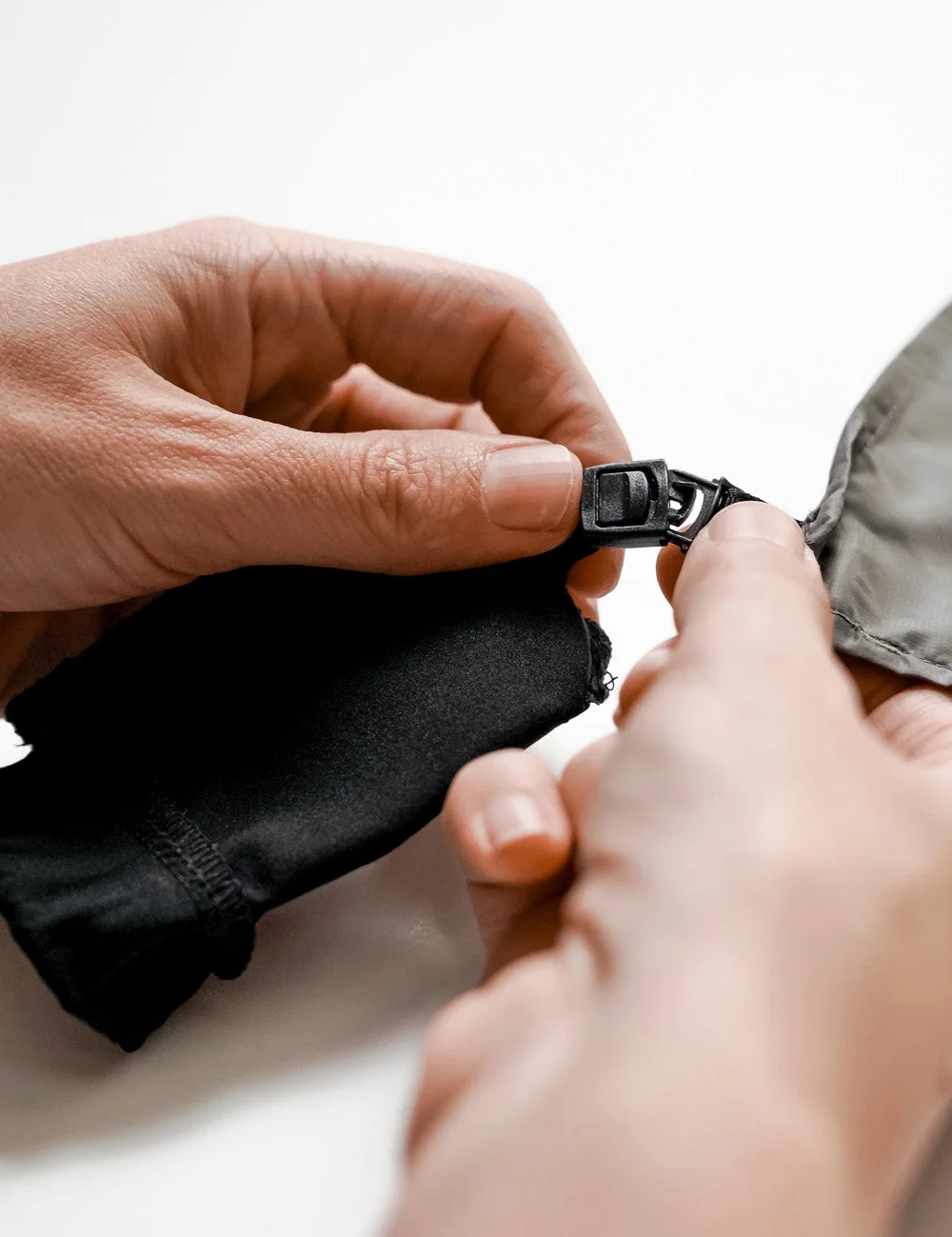 Attaching the detachable storage pouch.
