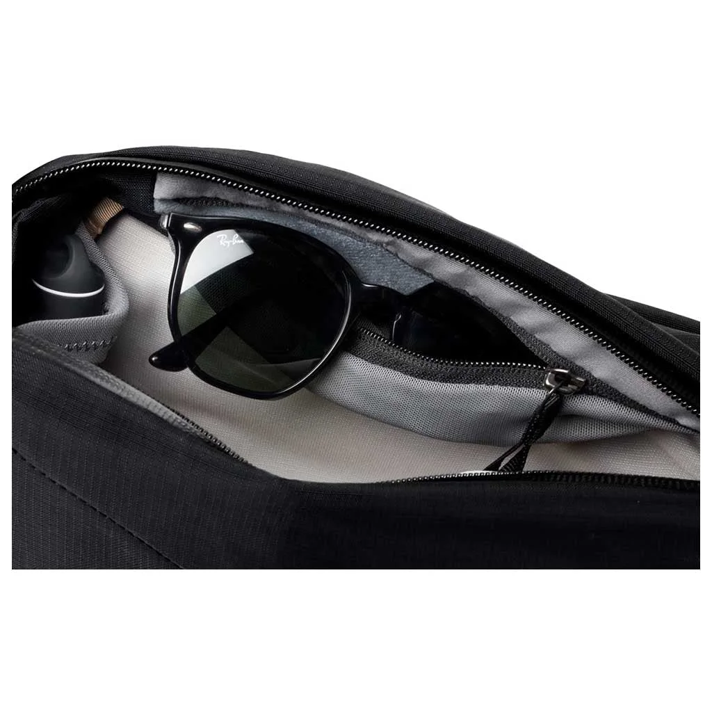 Soft-lined internal pocket shown with sunglasses, which are not included.