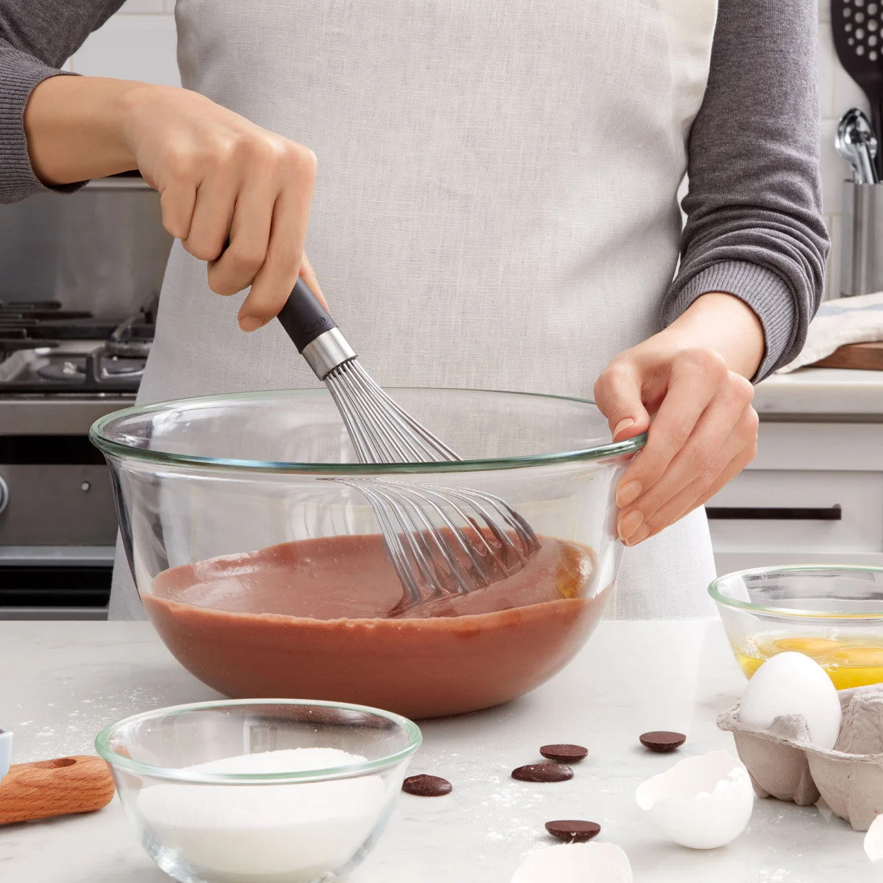 Manufacturer reference demonstrates bowl mixing; bowl and ingredients are not included.