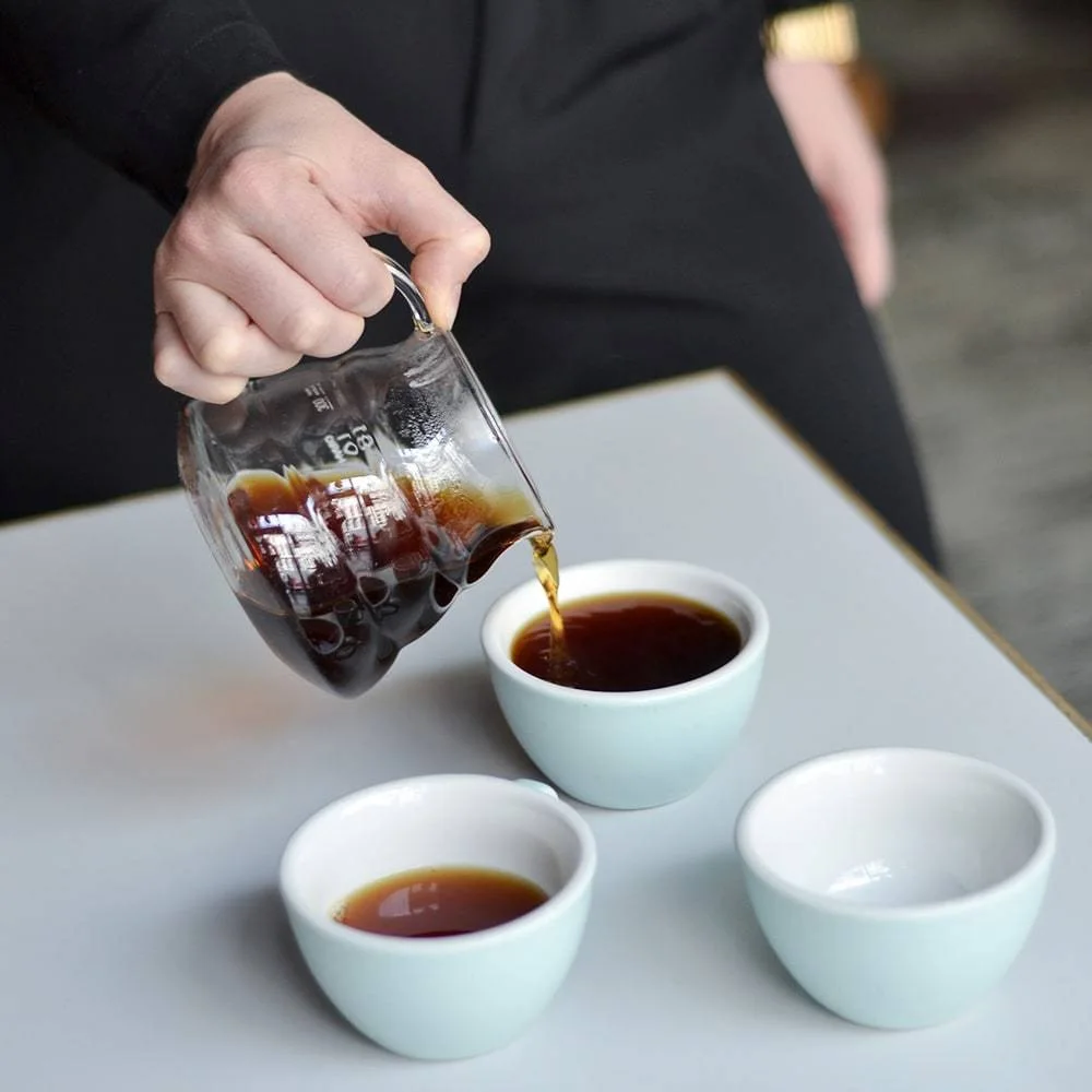 One brew divided between cups; cups and coffee are separate.