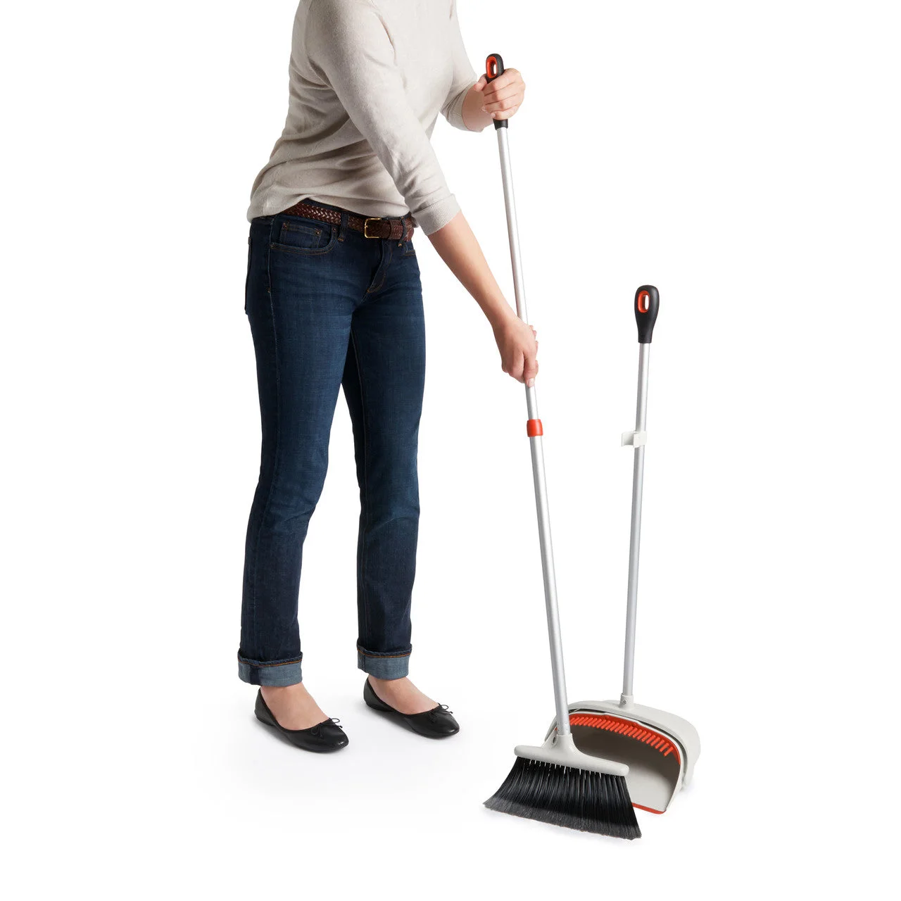 Broom can retract for controlled collection of a small dirt pile.