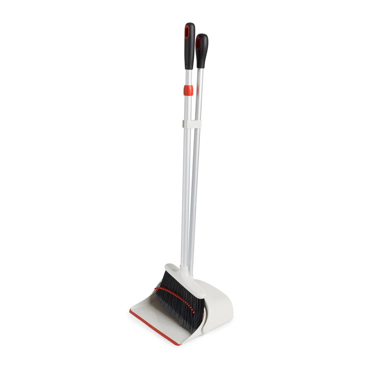 Broom clips into the pan handle for upright storage.