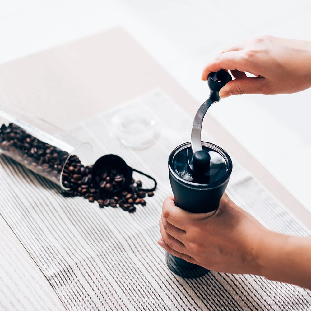 The small hopper is filled with coffee beans.