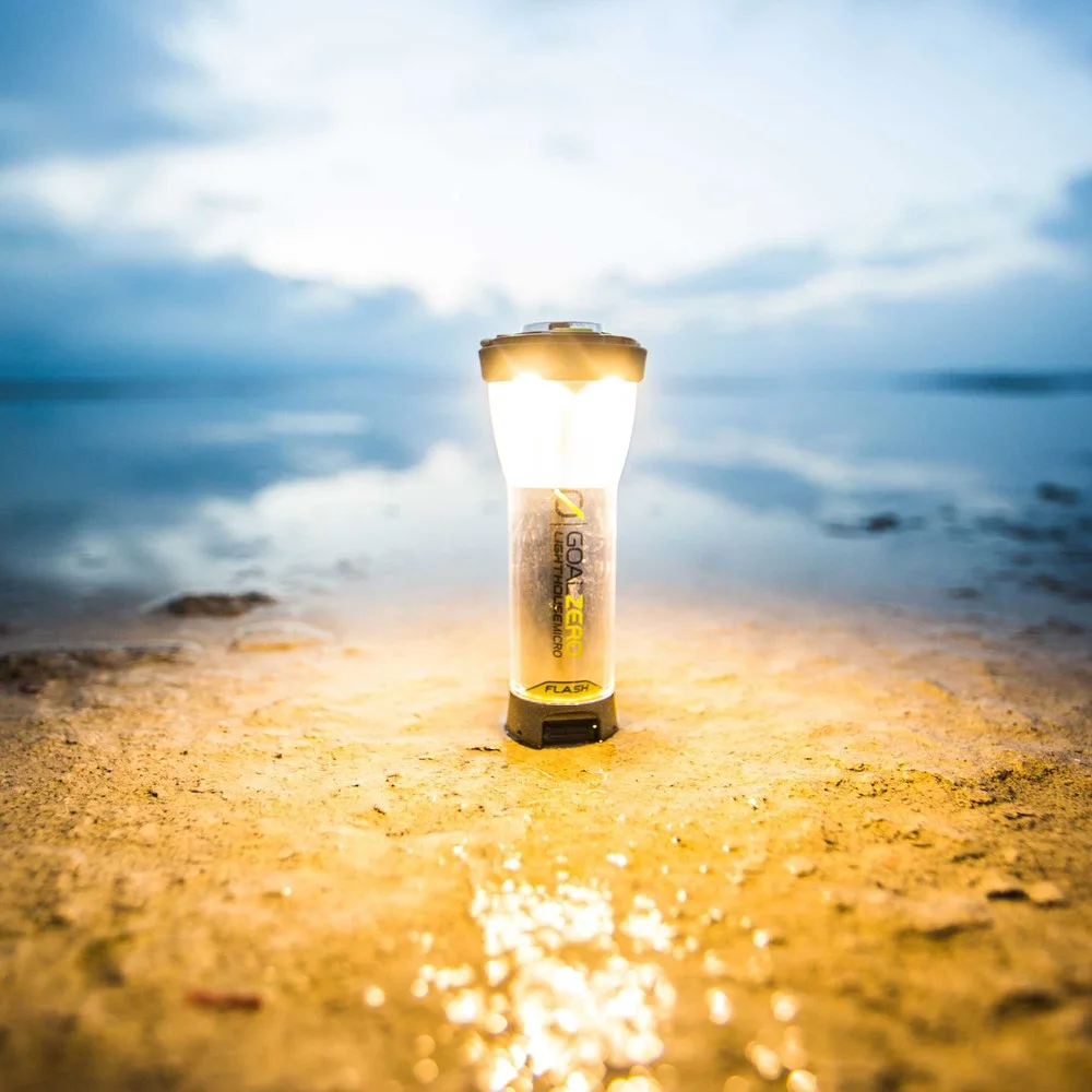 The small lantern standing on a flat surface.