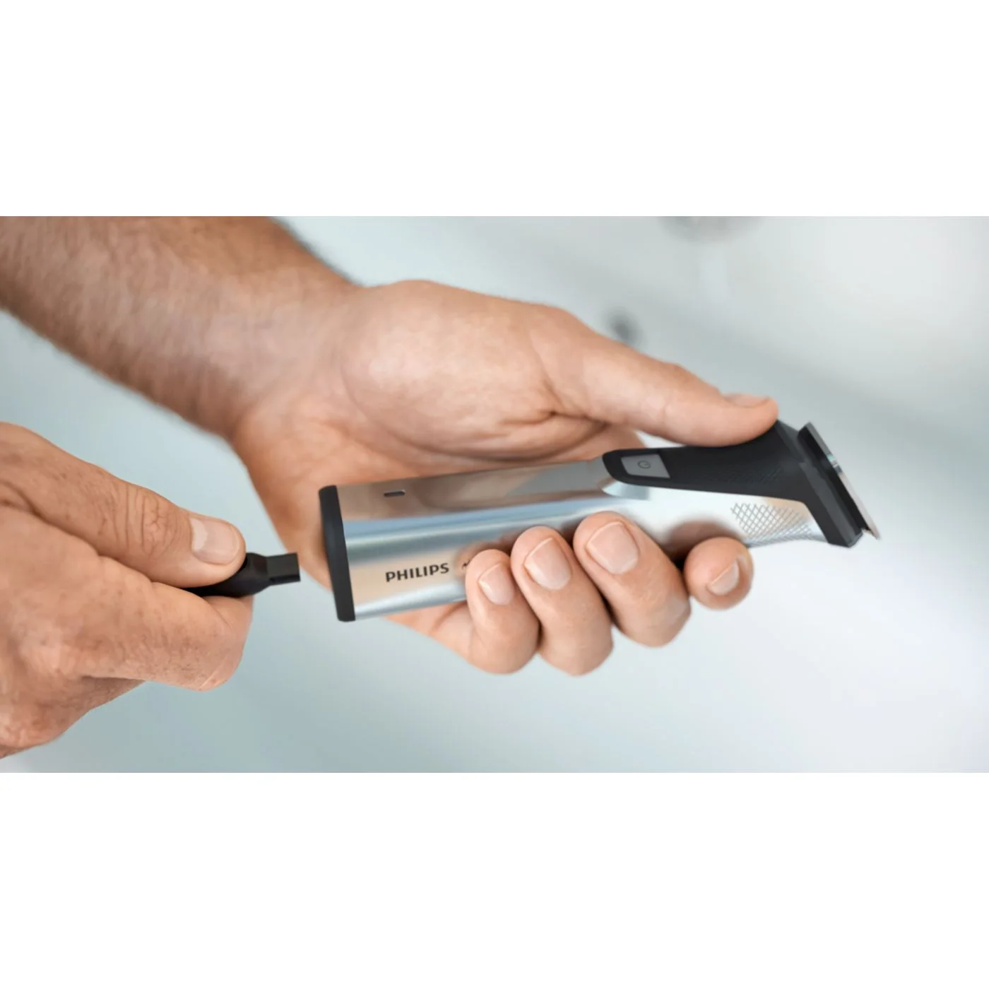 Charging connector shown with the metal handle; not a claim of USB-C charging.