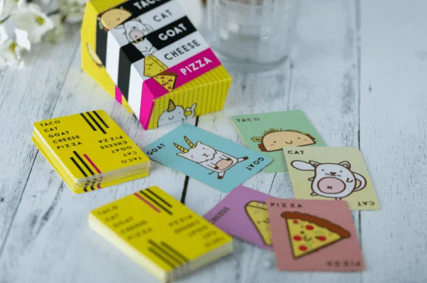 The box and illustrated cards spread out together.