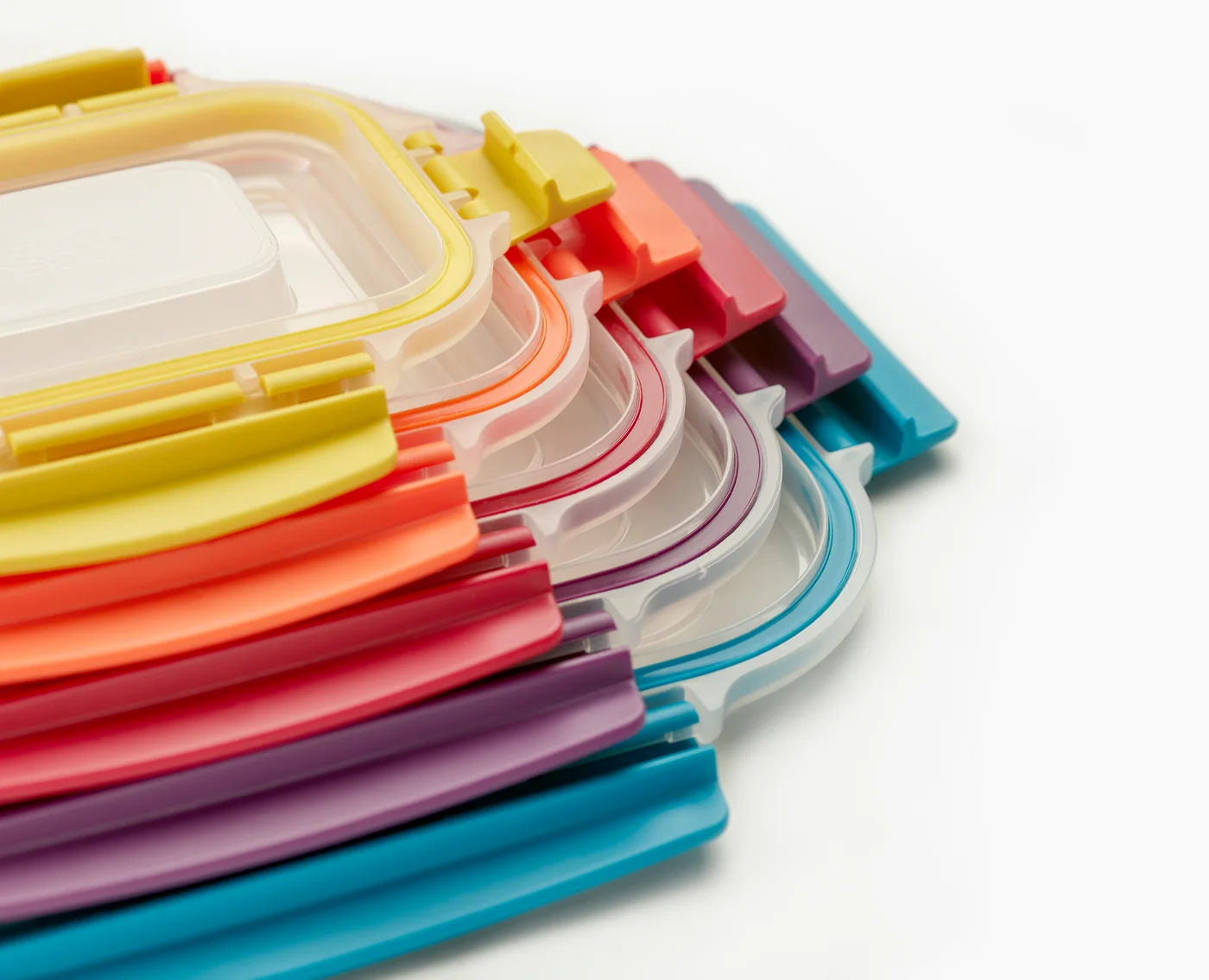 Colour-matched lids stacked together for empty storage.