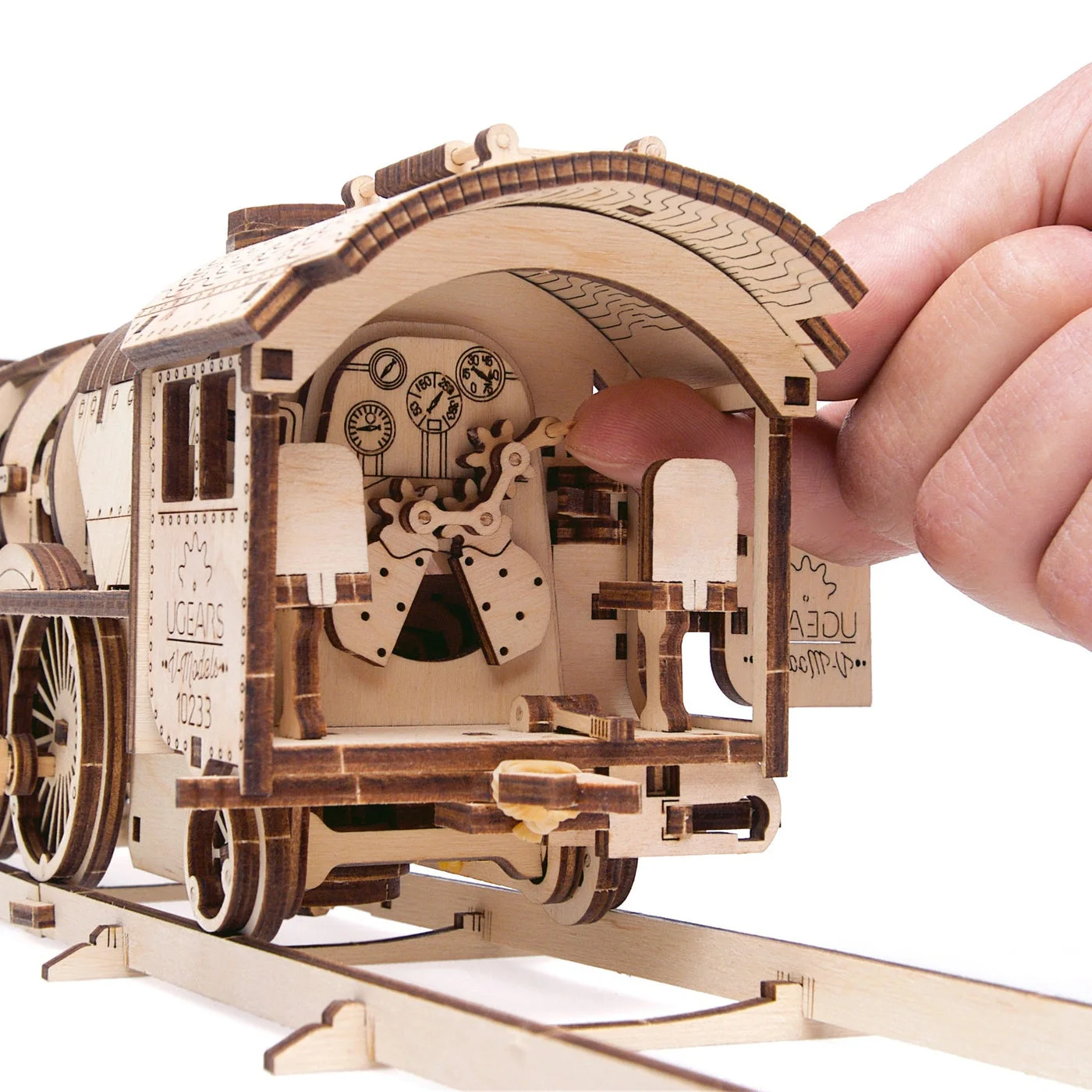 Manufacturer close-up demonstrating access to the model's wooden mechanism.