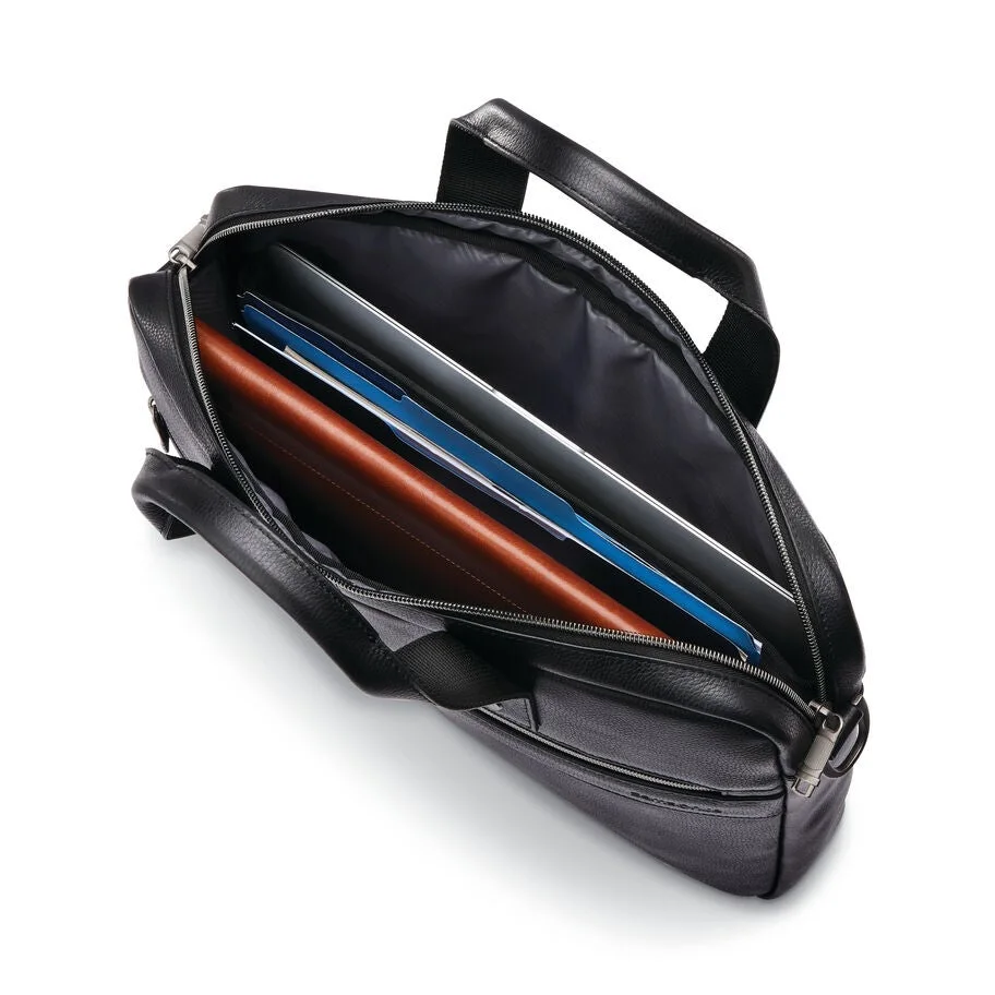 Padded main compartment shown with illustrative work items, not included.