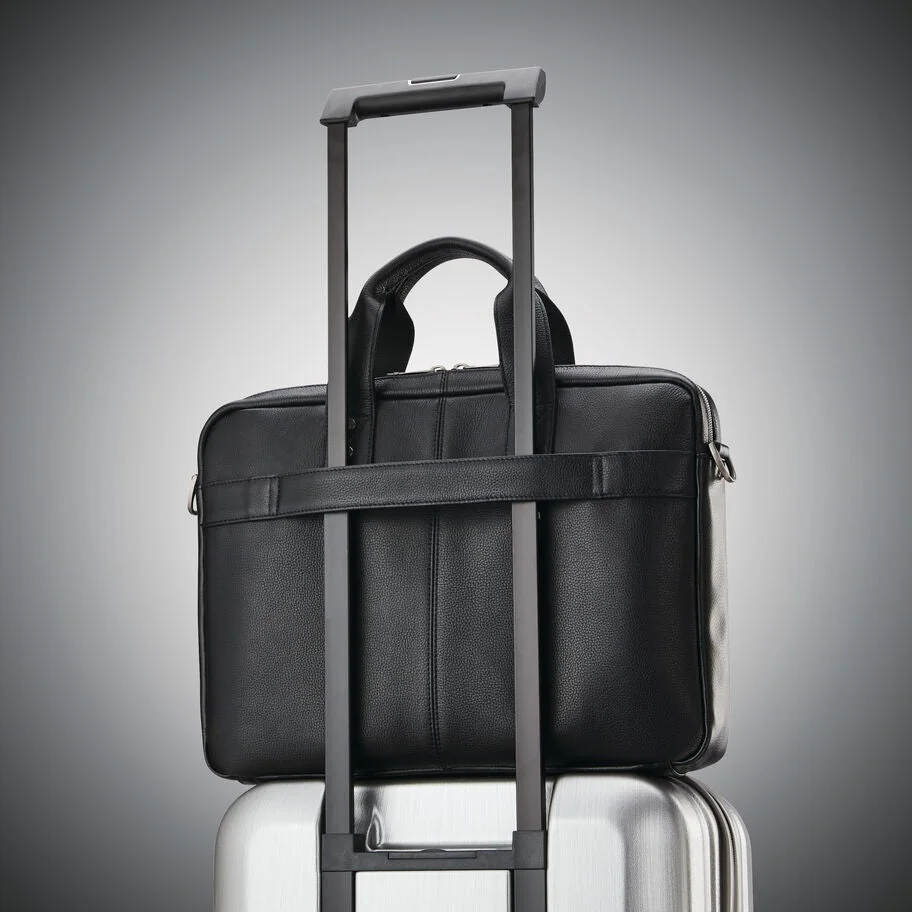 Rear SmartSleeve on a rolling-luggage handle; suitcase is not included.