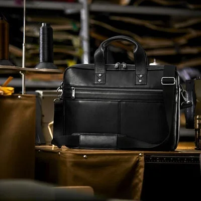 Manufacturer desk scene showing the brief standing beside work items.