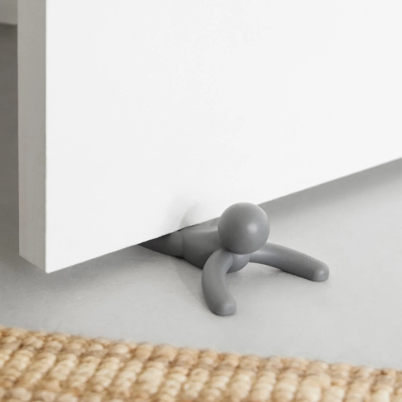 Buddy positioned under an interior door.