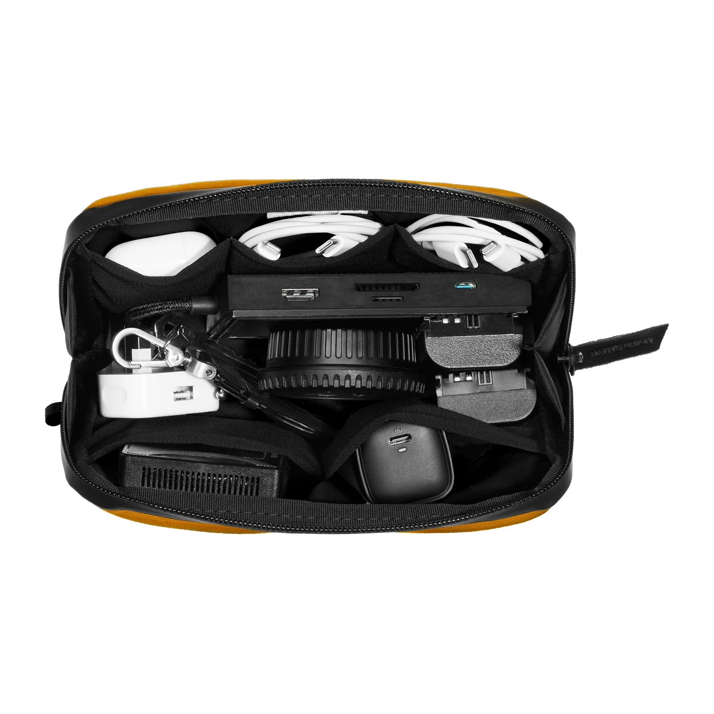 Kraft organizer with an example accessory load; electronics are not included.
