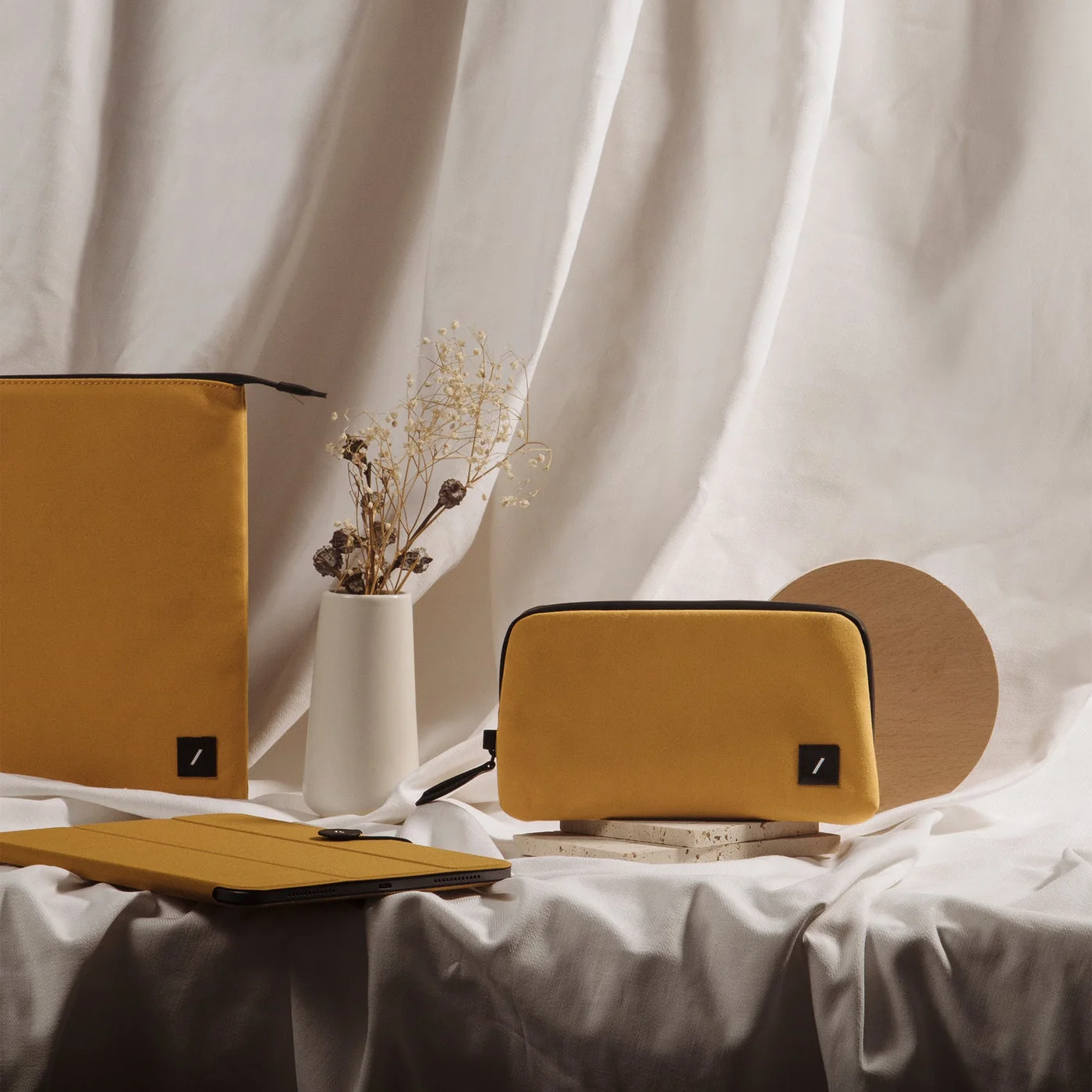 Kraft pouch on a desk beside separately sold accessories.